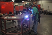Working welding a piece of metal